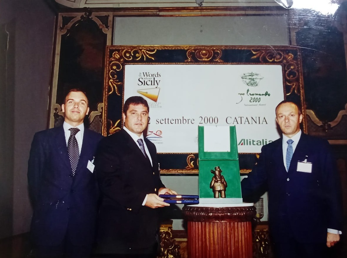 Award ceremony in Catania, Italy, in September 2000, with the Alitalia logo on the backdrop