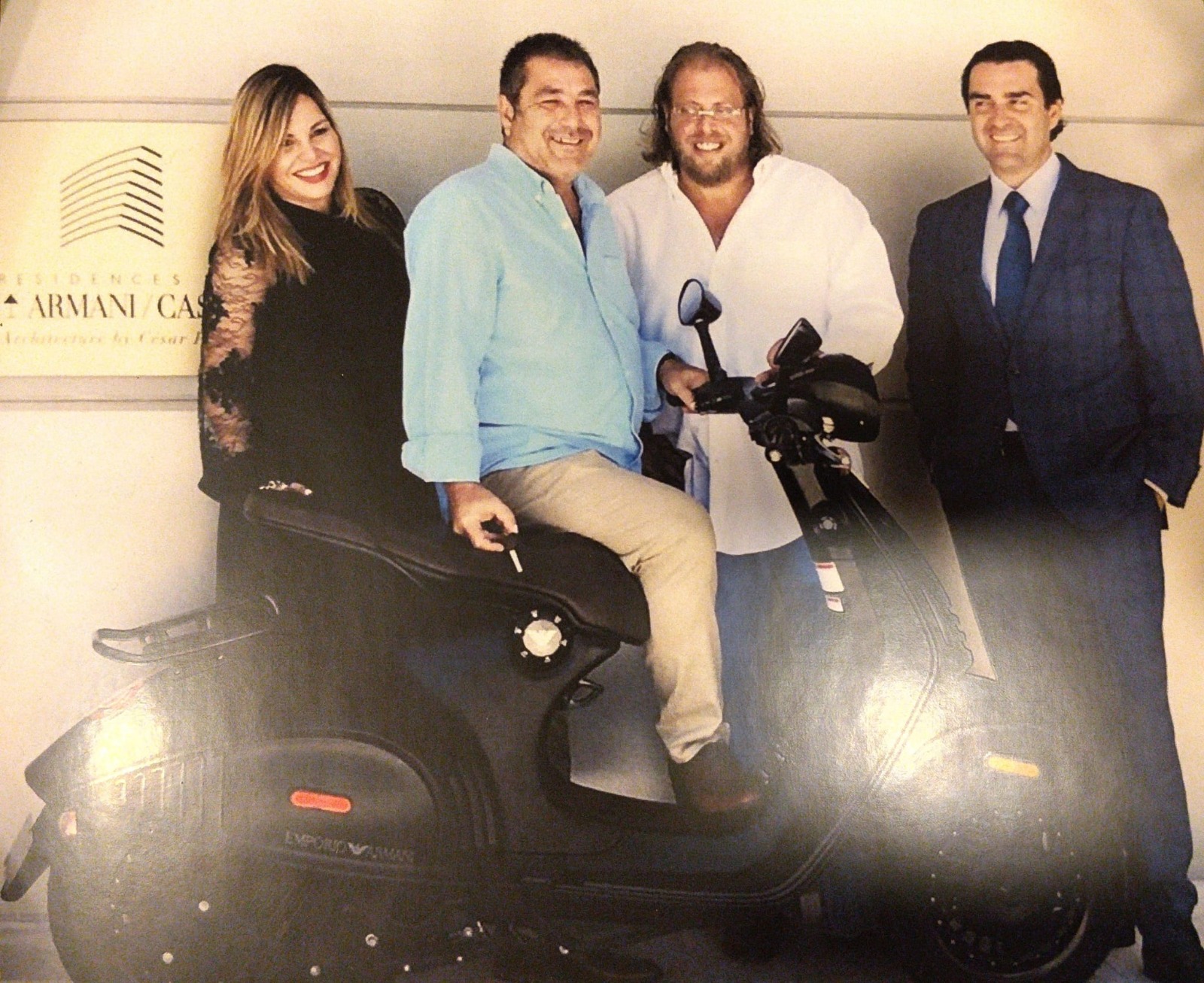 Limited-edition Armani-designed Vespa presented as an award for record sales at Armani Residences Sunny Isles, photographed in front of the Armani/Casa sign